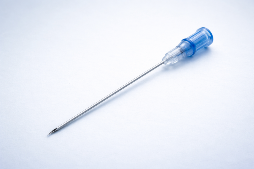 sterile needle on blue background